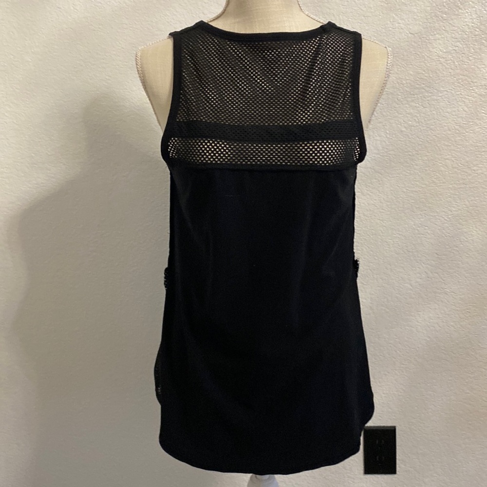 Black tank top with mesh destabilize on the back/chest/side